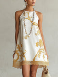 Heloisa| Vestido mini de encaje blanco con motivos dorados